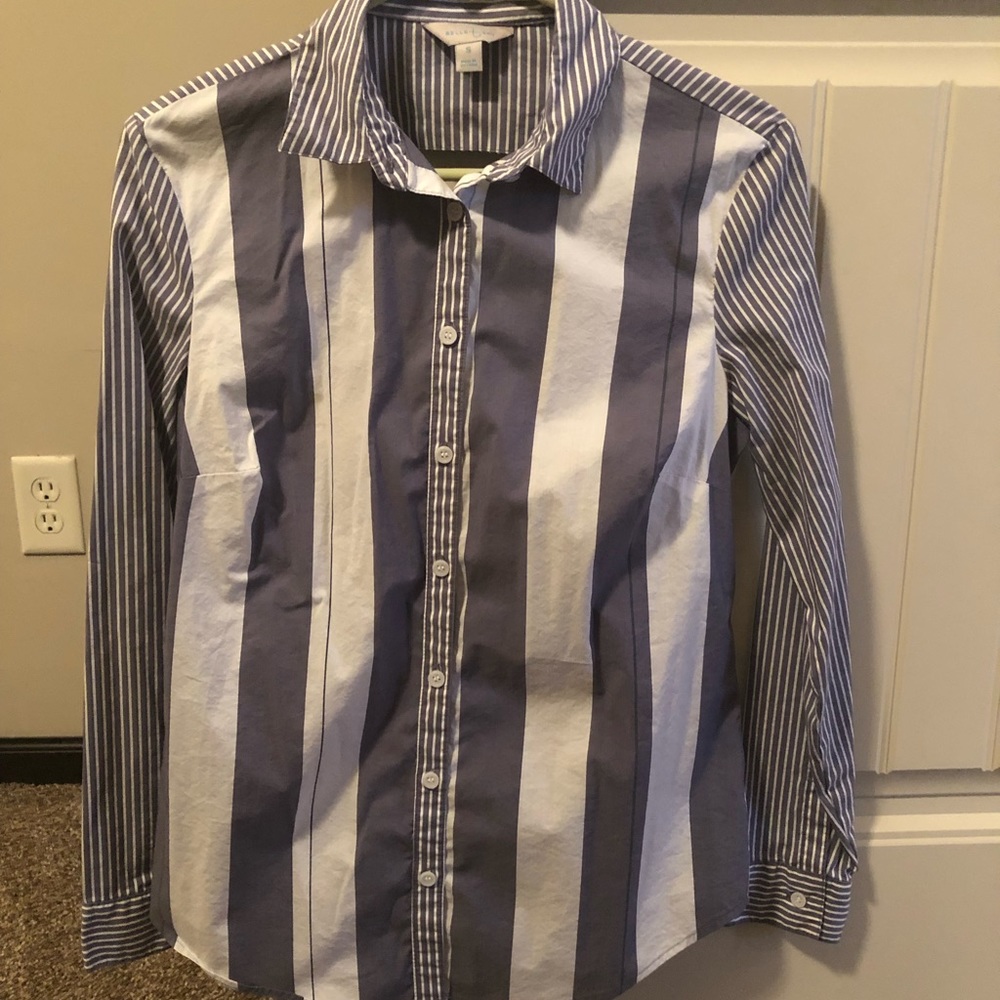 Dressy button down top with drop in the back.